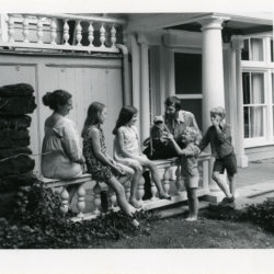 1994: Henson Family in front of Greenwich, CT home, 1970. From left: Jane, Lisa, Cheryl, Jim, John and Brian Henson. 1994, Photo by Juliet Newman. Courtesy of the Henson Family