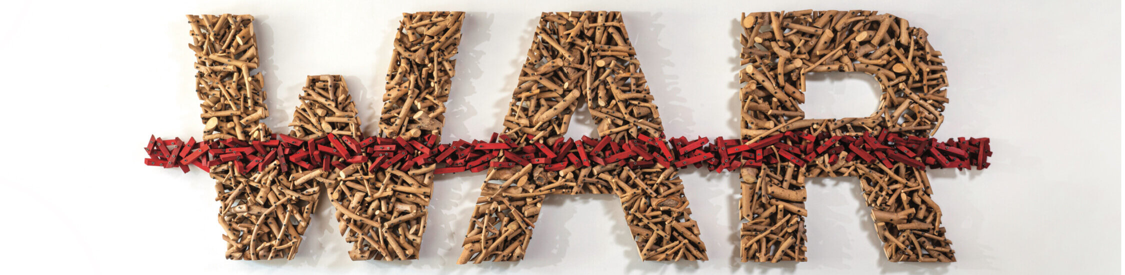Gyöngy Laky, “Globalization III: Red Ink”, 2005. Ash Branches, Commercial Wood, Paint, and Screws, 32 in. x 106.5 in. x 4 in.